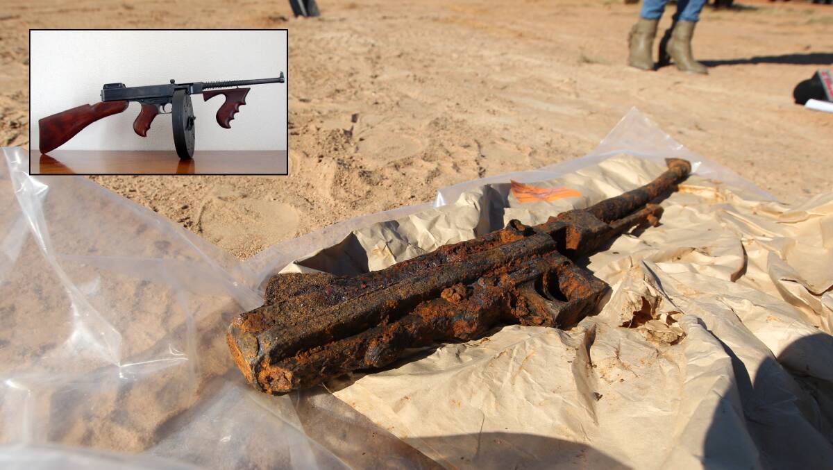 Mystery surrounds submachine guns found buried at Lake Hume