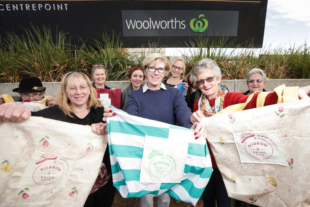 NEW: Shelley Robotham, Andrea Palmer and Sue Smith celebrate the end of single-use bags at Woolworths with other Boomerang Bag makers. Picture: JAMES WILTSHIRE 