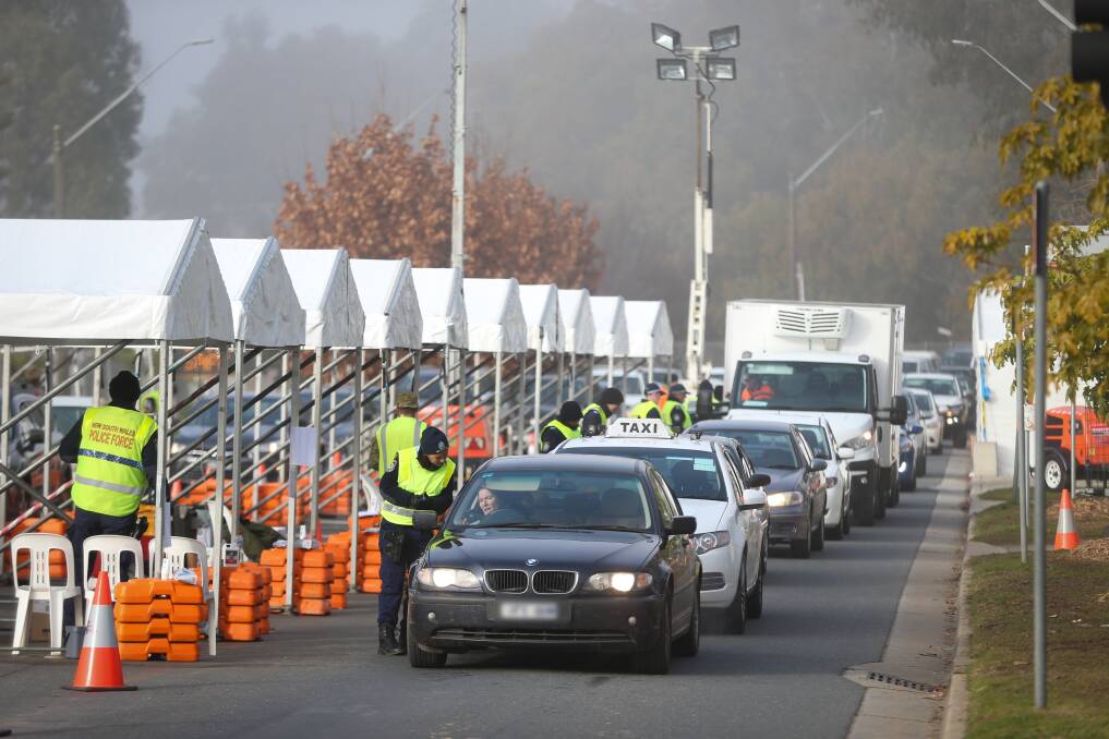 CONSTANT QUEUES: Albury and Wodonga were separated by police checkpoints last year for the first time in a century when NSW closed its border with Victoria. Picture: JAMES WILTSHIRE