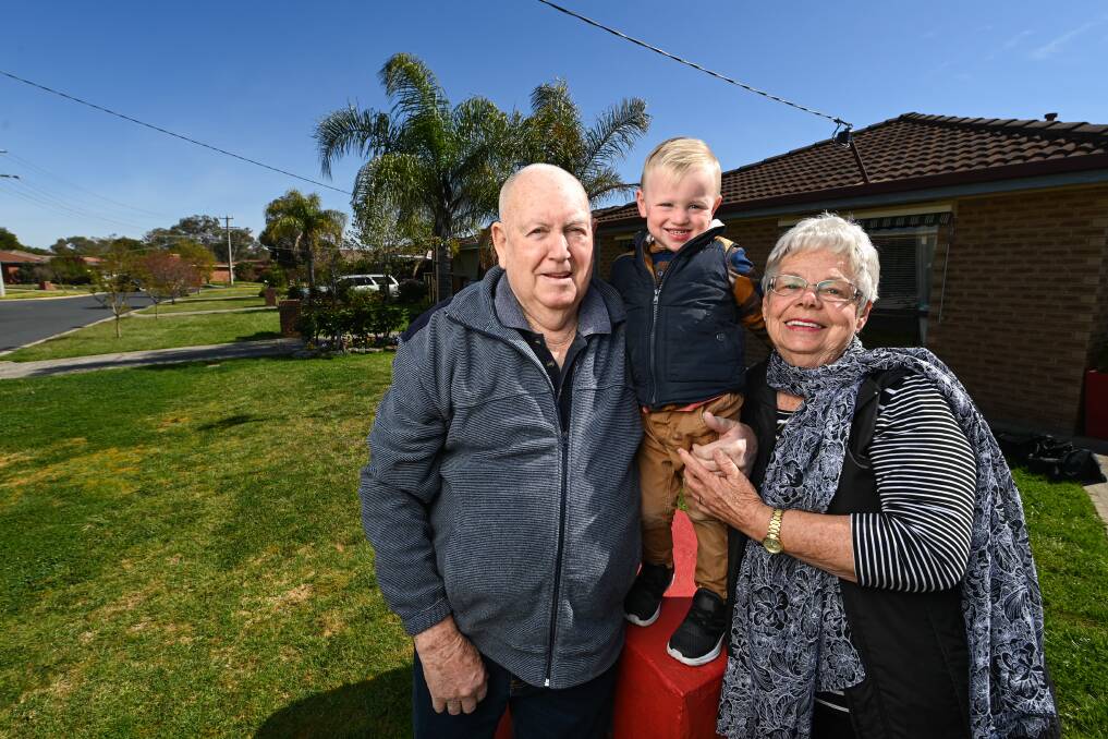 FOR HIM: Bill and Marie Orr, with great-grandson Jack Gamble, 2. Marie will shave her head during Sunshine Walk if she raises $5000 for the Albury Wodonga Cancer Centre. Picture: MARK JESSER