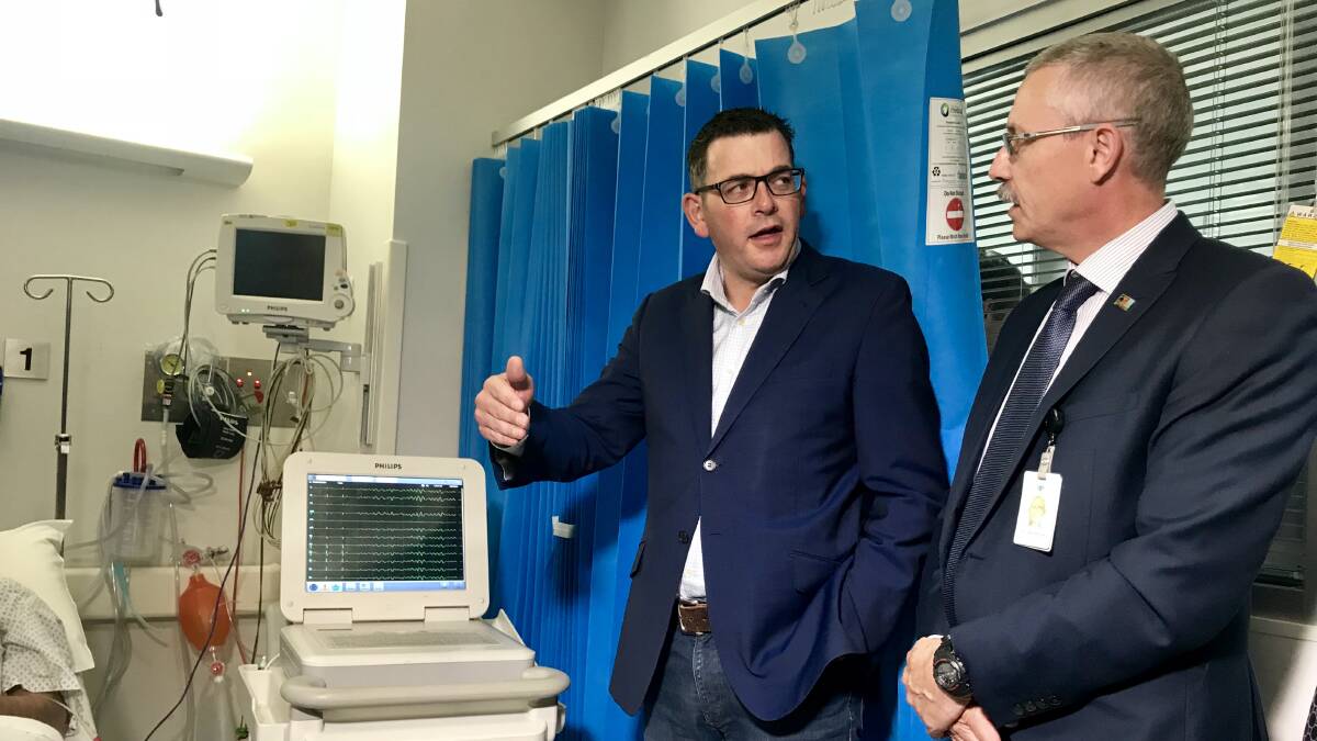 CRITICAL CARE: Premier Daniel Andrews talks to Wangaratta hospital medical services director John Elcock during yesterday's visit. Picture: SHANA MORGAN