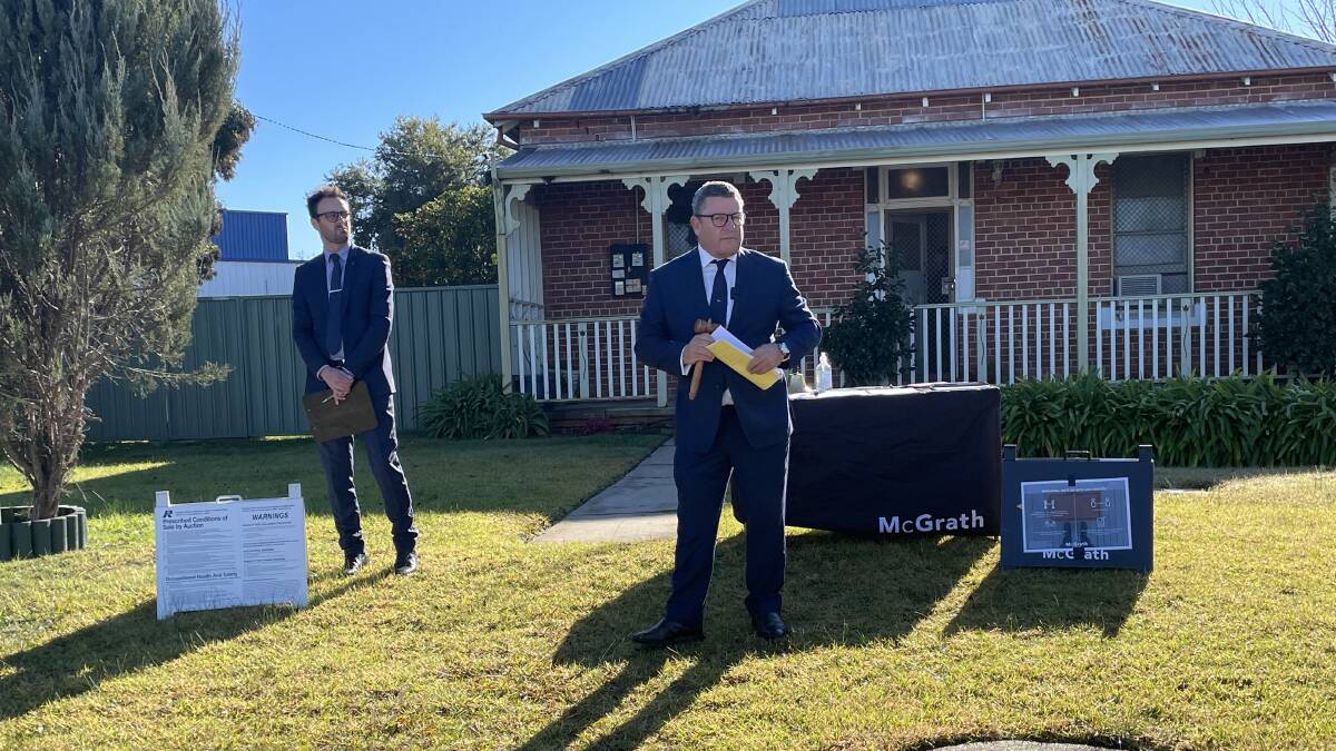 McGrath auctioneer Phillip Bell. The Union Road home was passed in at auction but later sold for $250,000. 