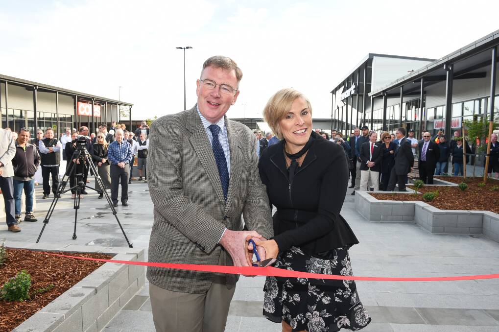 NEW BEGINNING: Bruce Mann with Wodonga Mayor Anna Speedie cut the ribbon officially opening of the shopping centre. Picture: MARK JESSER 