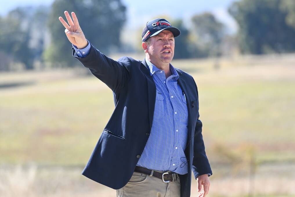 SALE SATURDAY: Cameron Hilton of Corcoran Parker auctioning 2206 Beechworth-Wodonga Rd, Leneva. The 18.4 hectare property was passed in before selling for an undisclosed price post-auction. Picture: MARK JESSER 