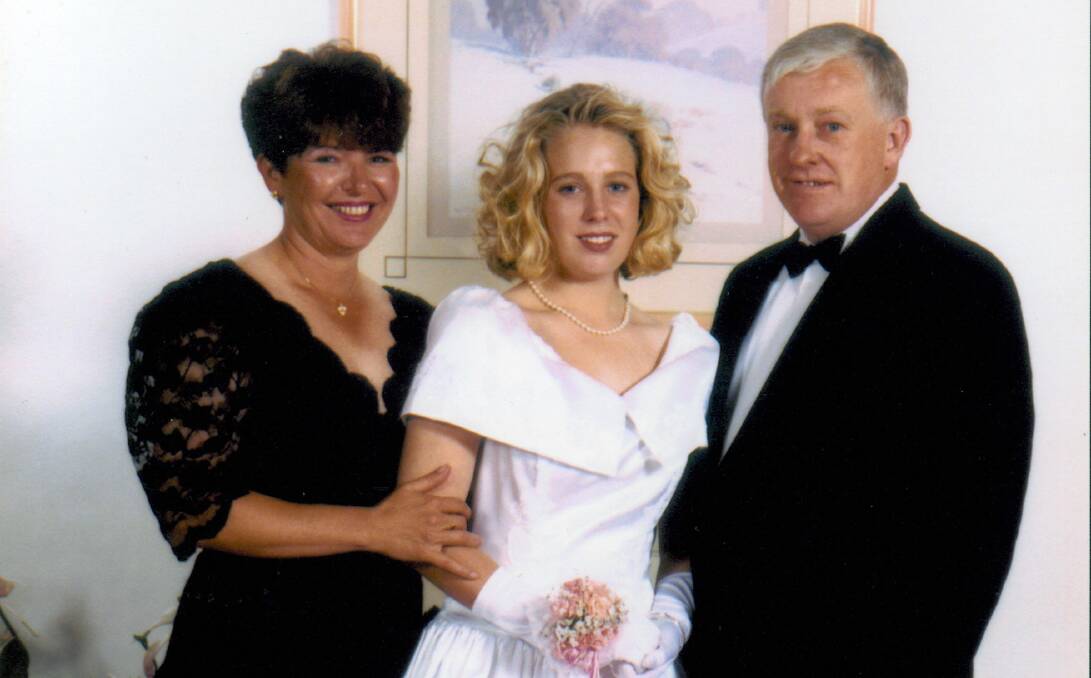 LOVED: Kim Meredith, aged 18, with parents June and Bob at her schools graduation.