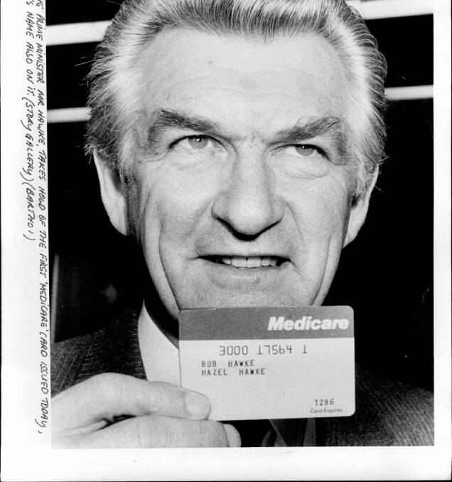 UNIVERSAL: Then-Prime Minister Bob Hawke shows off his brand new Medicare card in 1984 heralding the age of universl health care.