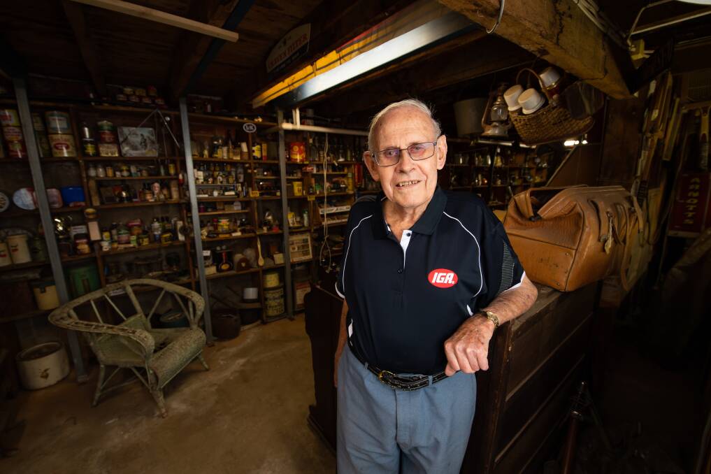 COLLECTOR: Les Dale in the basement of the Henty IGA which featuring a museum of the town. The store celebrates its 60th anniversary on Monday, while Mr Dale has been a business owner for 67 years. Picture: MARK JESSER