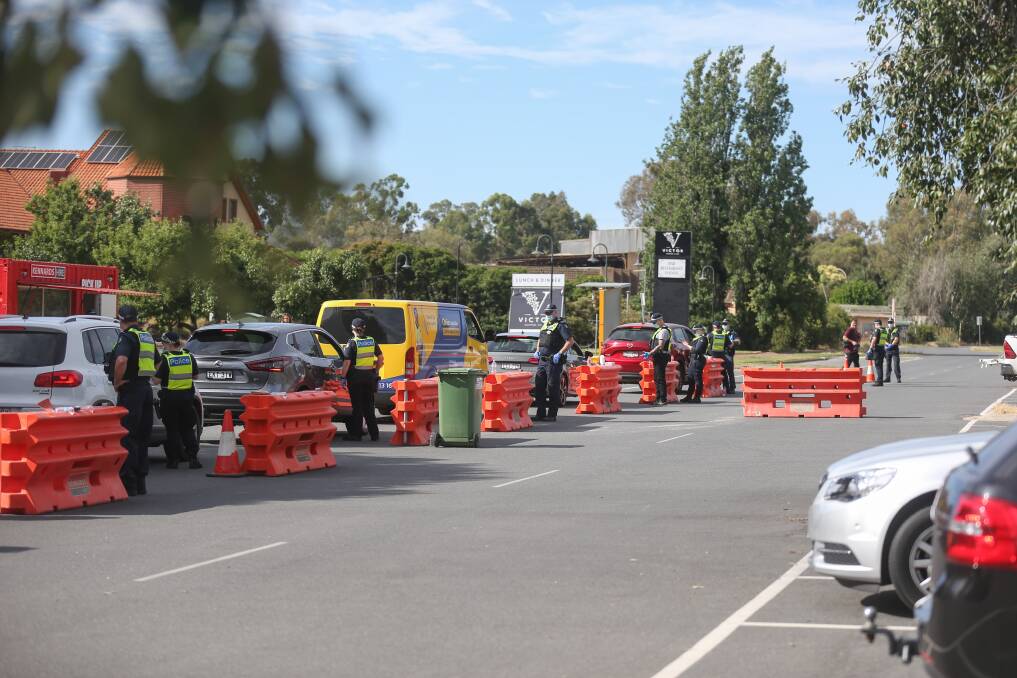HURT: The border checkpoint on December 21, with cars directed off the Lincoln Causeway and into the car-park at Gateway Village for checks. Picture: TARA TREWHELLA 