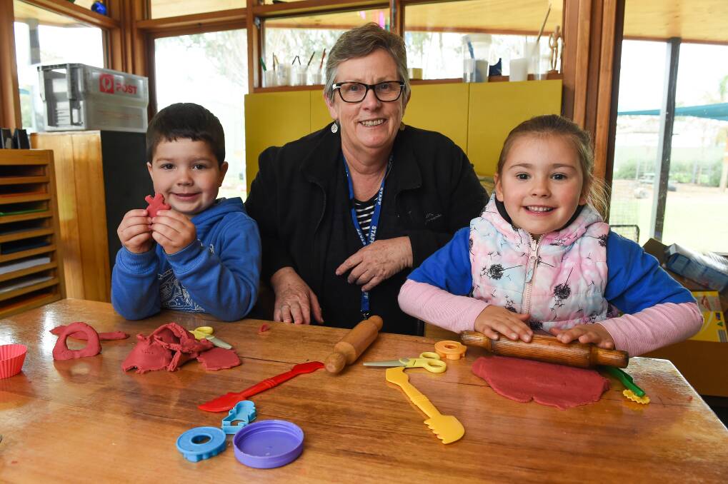  BEST START: Nola Bales manager family and early years with preschoolers Dominic Garoni, 4, and Ava Gale, 4, at Belgrade Ave Community Centre. Picture: MARK JESSER