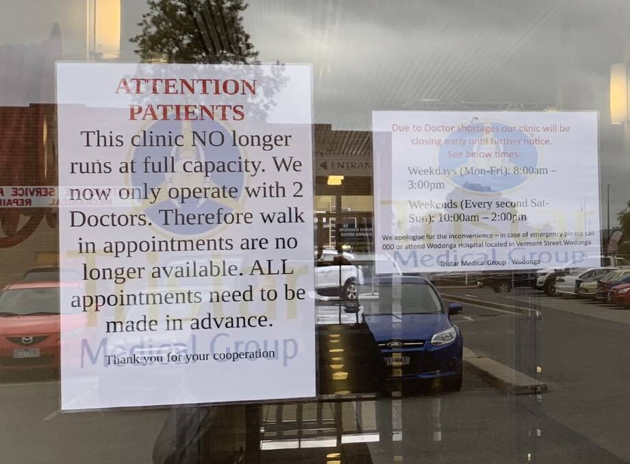 SHORTAGE: Signs on the doors to Wodonga's Tristar clinic have been erected in recent months to inform patients of the doctor shortage and changed hours. 