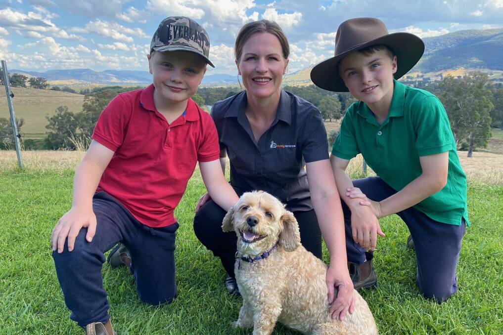  BE ALERT: Clancy Miller, 8, Nadine Miller and Henry Miller, 11, with Maple Syrup. Ms Miller has warned owners to keep their pets close as there are many snakes around this season