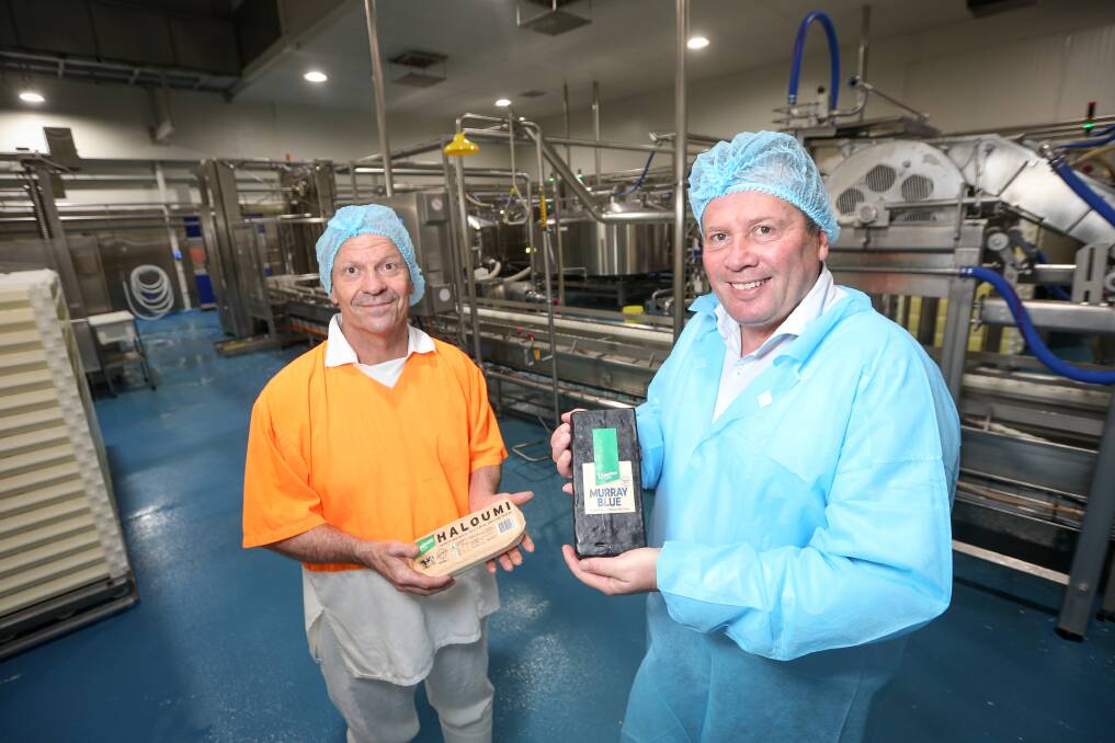 SAY CHEESE: Senior cheese maker Graeme Cook and Riverina Dairy Franck Beaurain with some of their products. Picture: JAMES WILTSHIRE