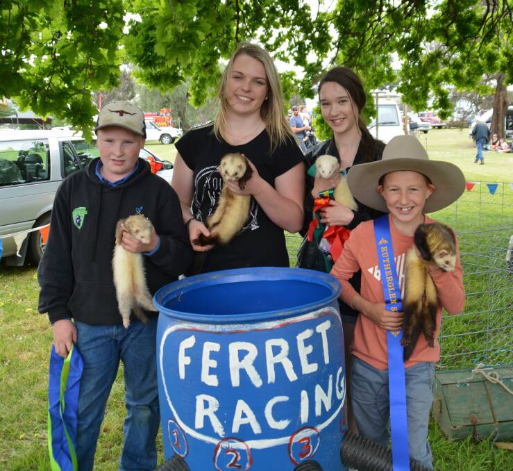 FERRET FUN: Competitors show off their prize ferrets after the 2018 event. The obstacles course race will return this year. 