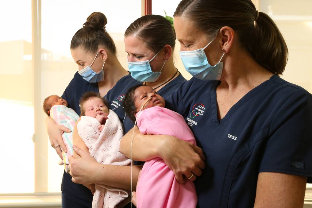 HANDS FULL: Albury Wodonga Health's Molly Pryse with Ellis, Christeena Slee with Darcie, and Tess Brown with Dhvija. Picture: JAMES WILTSHIRE 