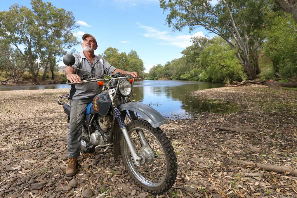 ON THE RIVER: Jingellic fire captain Alby Maras on the banks of the Murray River where the fire jumped his property and crossed into Victoria.