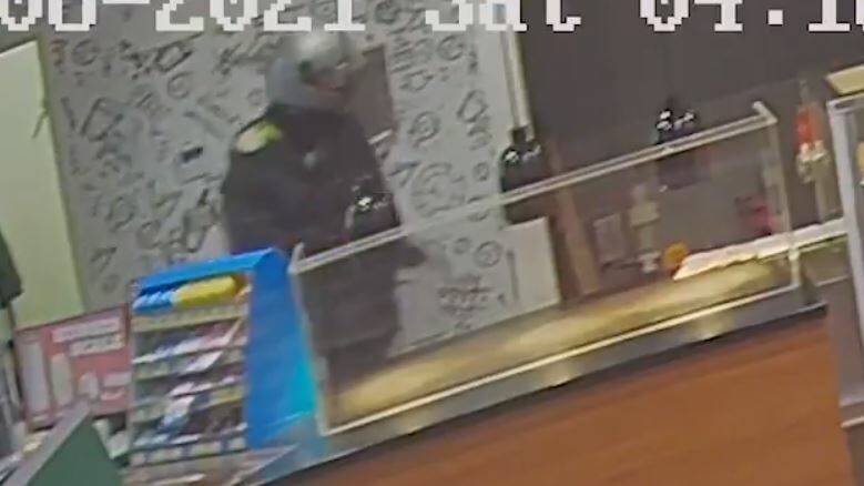 ARMED: CCTV from the Wodonga service station in the early hours of Saturday morning, which occurred a short time before a similar incident in Lavington. 