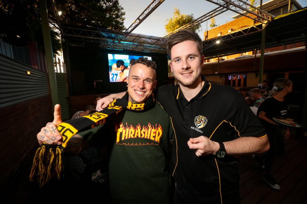  Mitchell Scholz and Sam Tremethick from Wodonga celebrating the AFL Grand Final at Beer Deluxe. Picture: JAMES WILTSHIRE
