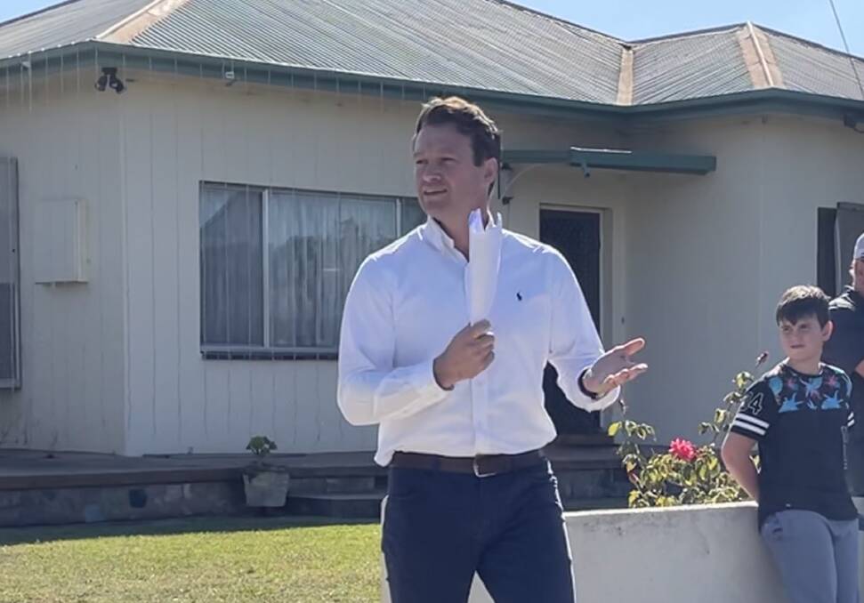 BIG BIDDER: Lachlan Hutchins of Stean Nicholls Real Estate auctioning 403 Macauley Street, South Albury. It and 399 Macauley Street sold to a single bidder for a combine $1.68 million. 