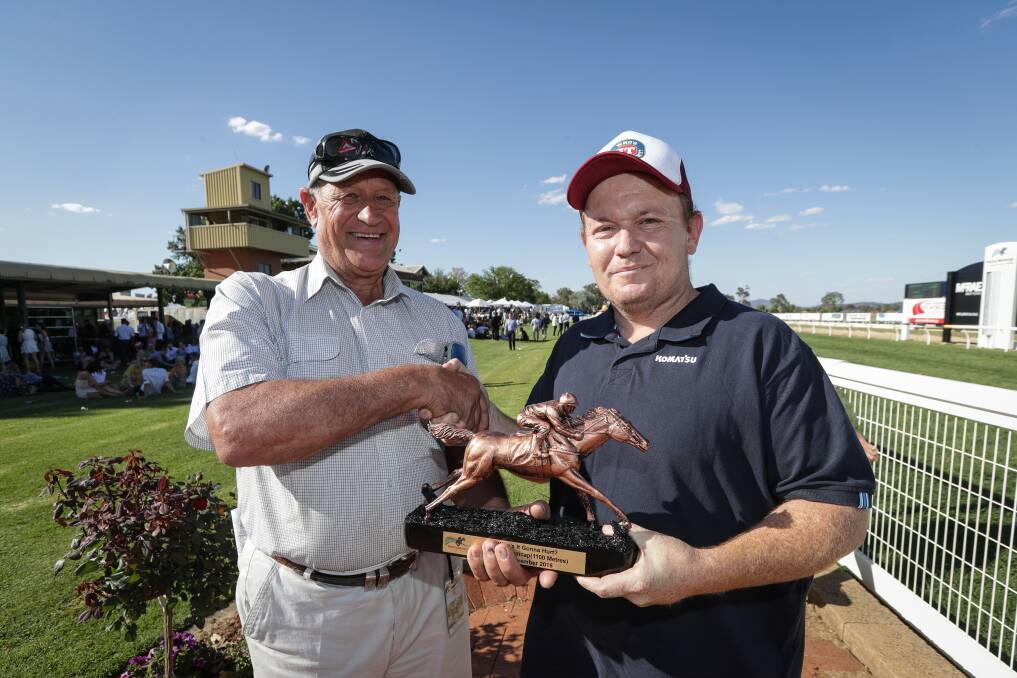  STRONG MESSAGE: Reve Wysman and Michael Rose with the trophy for the winner of the final race for the 'Who's it gonna hurt?' campaign. Picture: JAMES WILTSHIRE