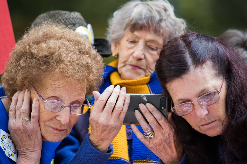 Rhonda Janetzki (right) and members of the public listen to the live sentencing of George Pell. Picture: JASON SOUTH