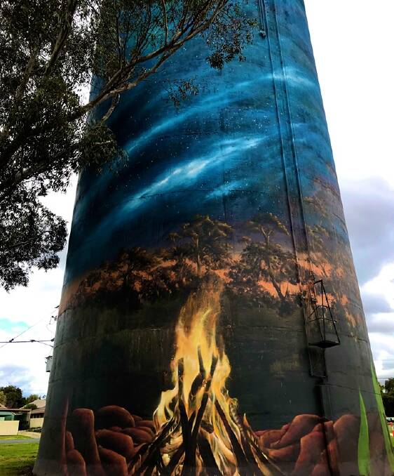 STARRY NIGHT: The campfire and night sky painted on one side of the water tower. Picture: SUZY KEYS, Deniliquin and District Historical Society
