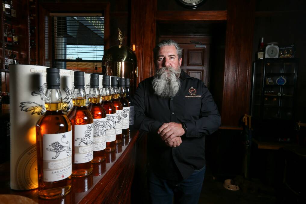 MYTHICAL: Chris Maney, owner of Two Fingers Barbershop and Bar with the rare Game of Thrones whiskey collection.