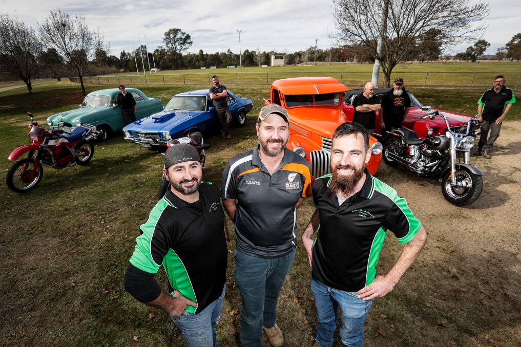 SHINING BRIGHT: Announcer Dave Williams with organisers Dave Graham and Daniel Nadebaum and Walla residents, all showing off wheels. Picture: JAMES WILTSHIRE