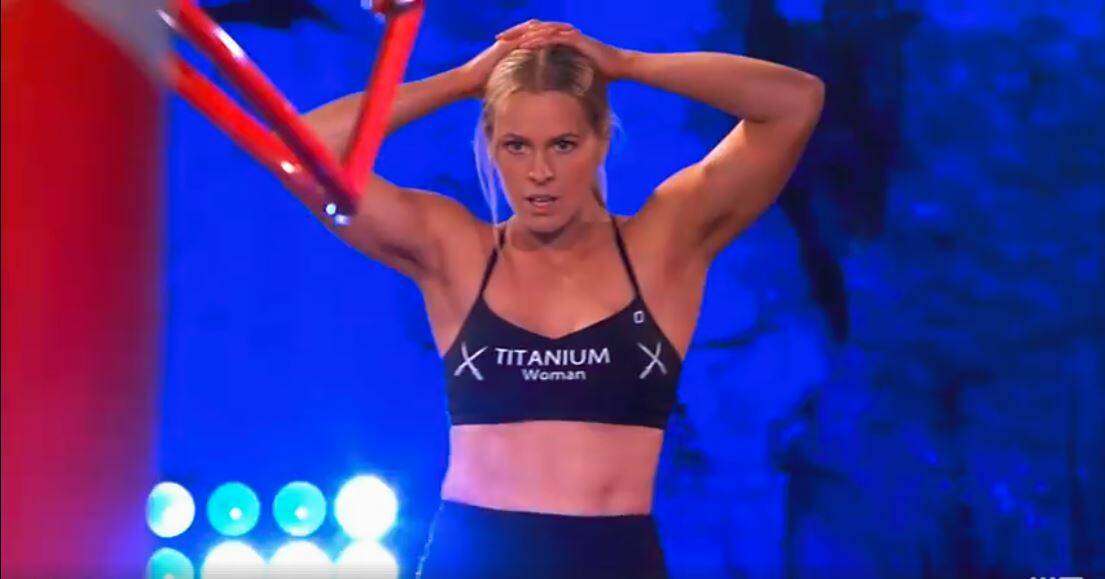 DETERMINED: Titanium woman Zoe Featonby during the Australian Ninja Warrior course. Zoe will be going through to the semi-final. Picture: NINE
