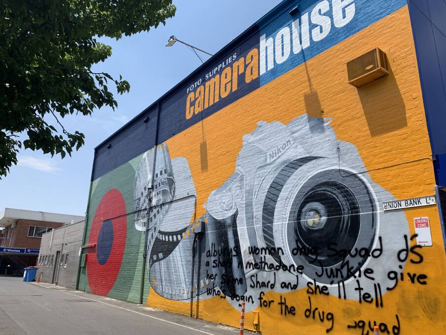 The graffitied mural at Foto Supplies Camera House. 