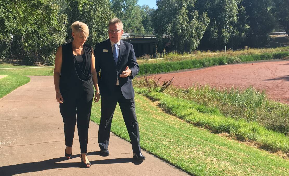 IN STEP: Wodonga mayor Anna Speedie and Albury mayor Kevin Mack on Gateway Island to discuss the sites potential. Picture: SOPHIE BOYD 