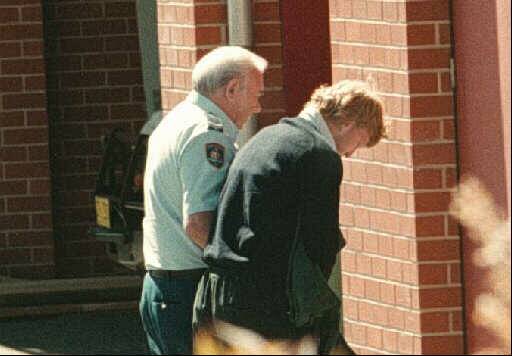 UNDER GUARD: Graham Mailes led into Albury Court for committal hearing.