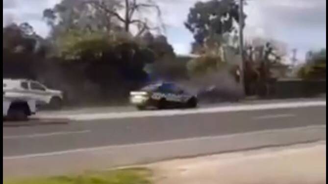 Watch as a car being pursued by police spins out of control