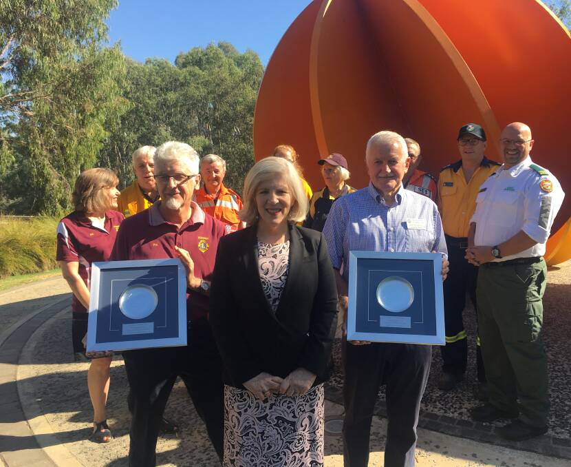 PROUD: Wodonga Lions Club Phil Wilkins, Good Friday Appeal executive director Anne Randall and Ted Thompson of the Rotary Club of Albury. Picture: SOPHIE BOYD