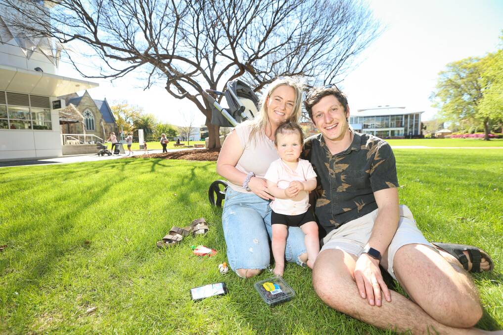 FREEDOM: Sam, Maddy and Katie Bowers, 1, enjoying life outside the house post-lockdown. The trio took to Albury's QEII Square on Saturday to celebrate lockdown ending. Picture: JAMES WILTSHIRE 