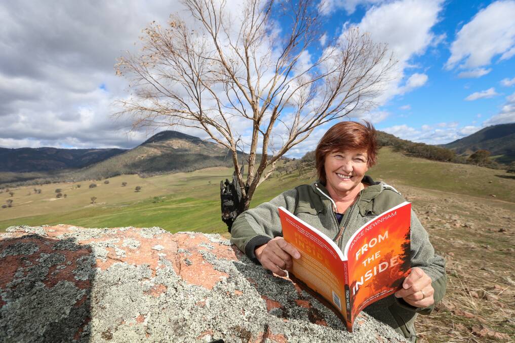 FROM THE INSIDE: Walwa's Janice Newnham has self-published a book on her experience during the Upper Murray Black Summer bushfires. She's already had to order a second run due to the huge interest. Picture: JAMES WILTSHIRE 