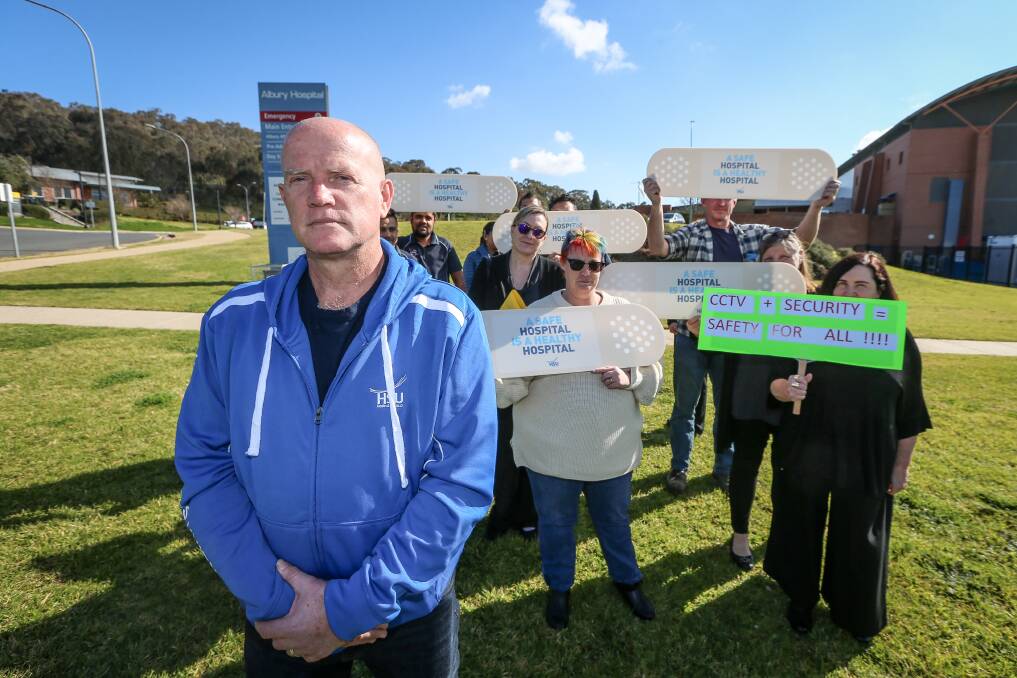 PROTEST: HSU Albury sub-branch president Carl Prentice and hospital staff during the one-hour stop work. Picture: JAMES WILTSHIRE 