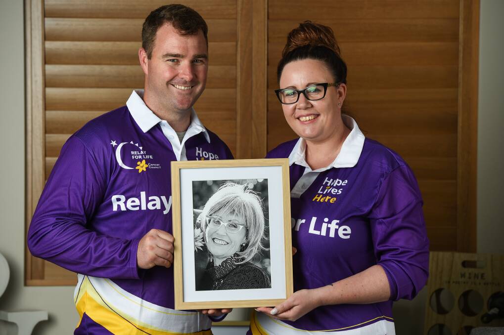 PROUD CHILDREN: David Milton and Bec Gouveia, with a portrait of their mother and 2017 Relay for Life Hero, Sandra Milton. The siblings hope their mother's 20-year cancer battle and lust for life inspires and provides hope to those battling. Picture: MARK JESSER
