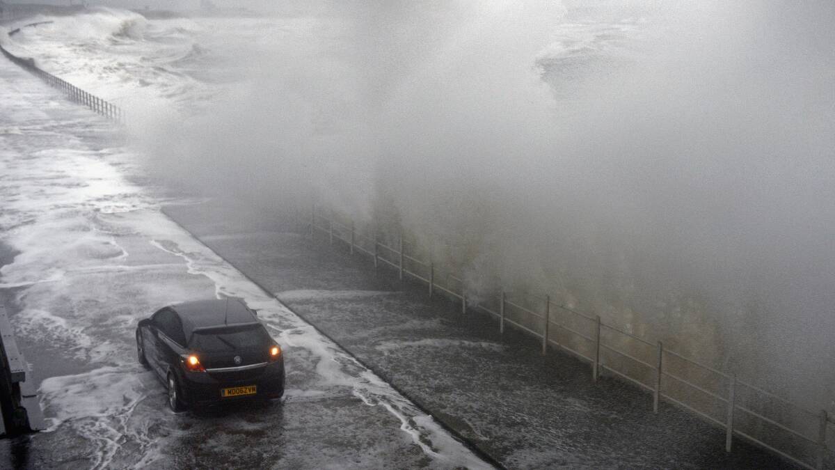 Waves break over Saltcoats Esplanade on January 3, 2014 in Saltcoats, Scotland. Picture: Getty