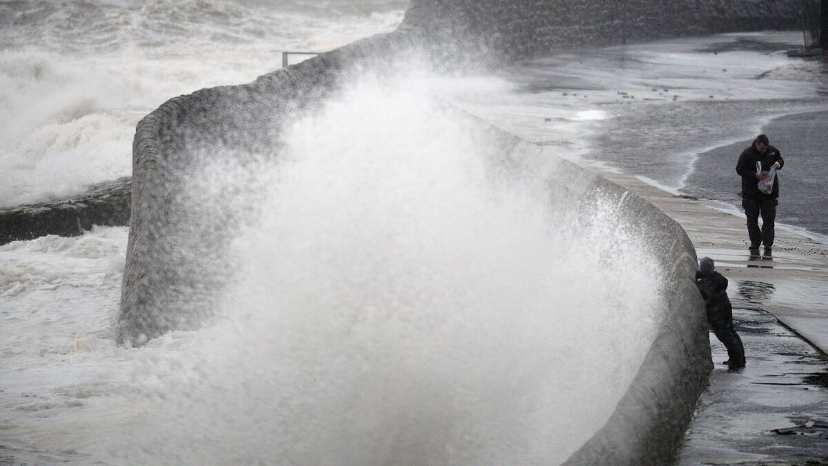 Waves break over Saltcoats Esplanade on January 3, 2014 in Saltcoats, Scotland. Picture: Getty