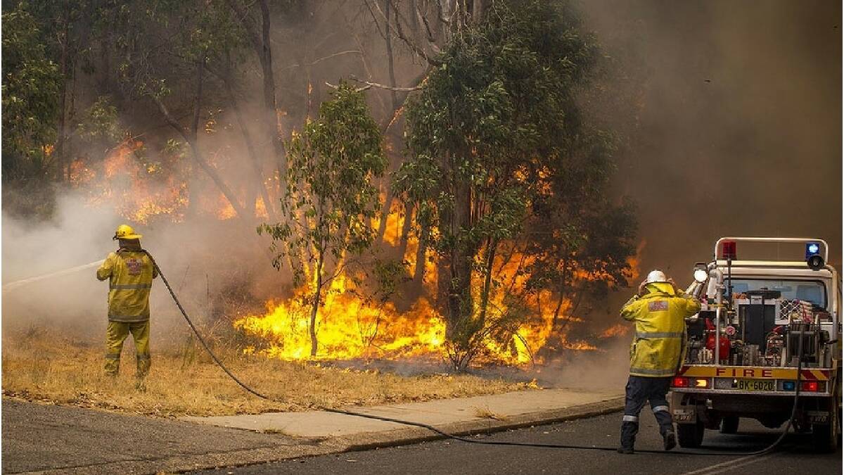 At the scene of the Perth hills bushfires in Stoneville. Photo: DFES/Evan Collis.