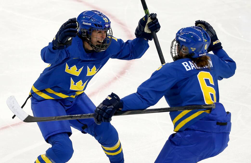 Lina Wester #13 of Sweden celebrates with her teammate Lina Backlin #6 after scoring a goal in the third period against Noora Raty #41 of Finland during the Women's Ice Hockey Playoffs Quarterfinal game on day eight of the Sochi 2014 Winter Olympics at Shayba Arena on February 15, 2014 in Sochi, Russia. Photo: GETTY IMAGES