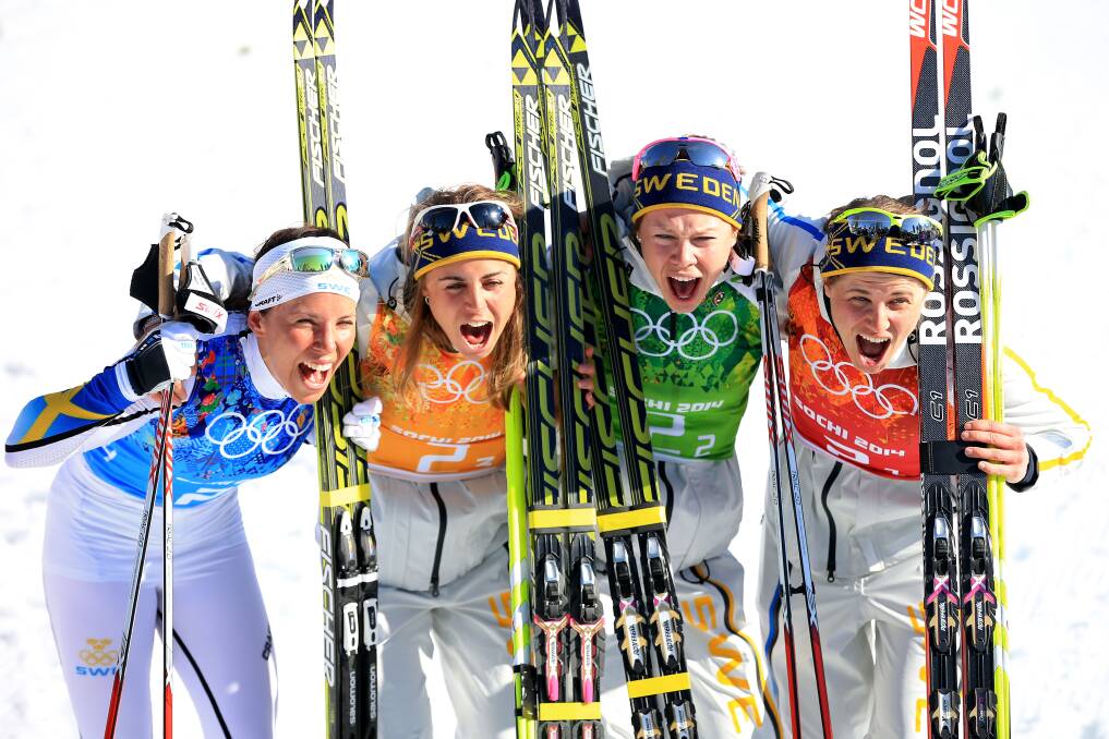 (L to R) Charlotte Kalla, Anna Haag, Emma Wiken and Ida Ingemarsdotter of Sweden celebrate winning the gold medal in the Women's 4 x 5 km Relay during day eight of the Sochi 2014 Winter Olympics at Laura Cross-country Ski & Biathlon Center on February 15, 2014 in Sochi, Russia. Photo: GETTY IMAGES