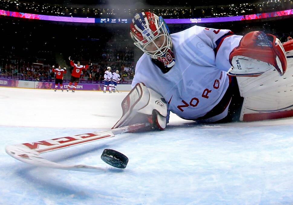 Lars Haugen #30 of Norway gives up a goal to Michael Rene Grabner #40 of Austria in the third period during the Men's Ice Hockey Preliminary Round Group B game on day nine of the Sochi 2014 Winter Olympics at Bolshoy Ice Dome on February 16, 2014 in Sochi, Russia. Photo: GETTY IMAGES