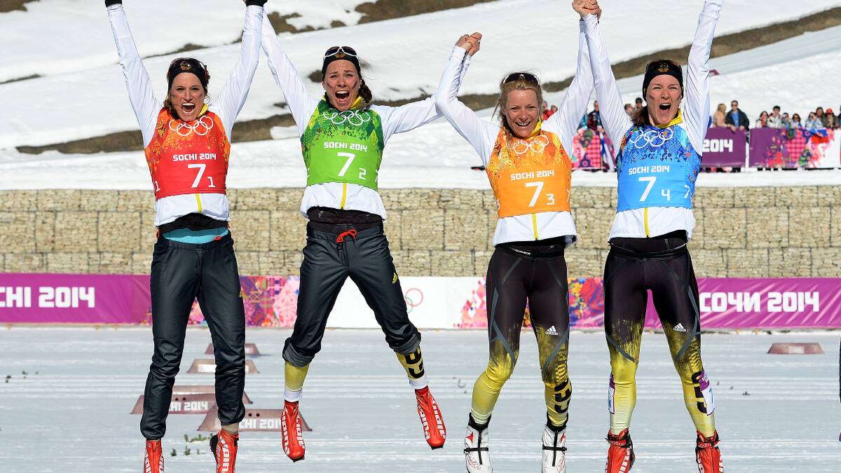 (L to R) Bronze medalists Nicole Fessel, Stefanie Boehler, Claudia Nystad, Denise Herrmann of Germany celebrate on the podium during the flower ceremony for the Women's 4 x 5 km Relay during day eight of the Sochi 2014 Winter Olympics at Laura Cross-country Ski & Biathlon Center on February 15, 2014 in Sochi, Russia. Photo: GETTY IMAGES