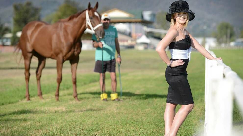 TAMWORTH: Hannah Herden strikes a pose as Tamworth Cup hopeful Jefferson Park, with strapper Chris Rock, gear up for tomorrow’s big race. Photo: BARRY SMITH, Northwern Daily Leader.