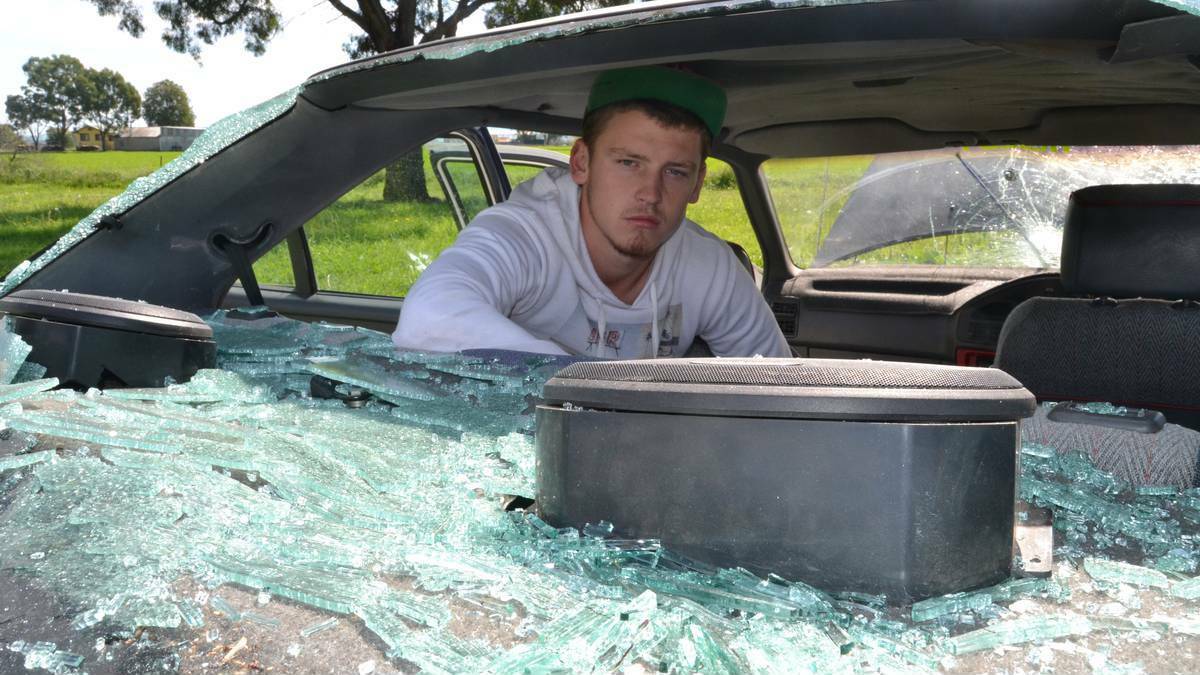 BATHURST: Nigel Simmons was devastated to find his white EA Falcon badly vandalised when he went to check on the car which was parked by the roadside on Hereford Street with numerous other vehicles up for sale. Photo: Western Advocate.