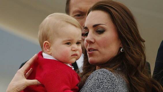 CANBERRA: Britain's Catherine, the Duchess of Cambridge, holds her son Prince George as they prepare to board a plane with her husband Prince William (not pictured) to depart Canberra April 25, 2014. Photo: PHIL NOBLE, Canberra Times
