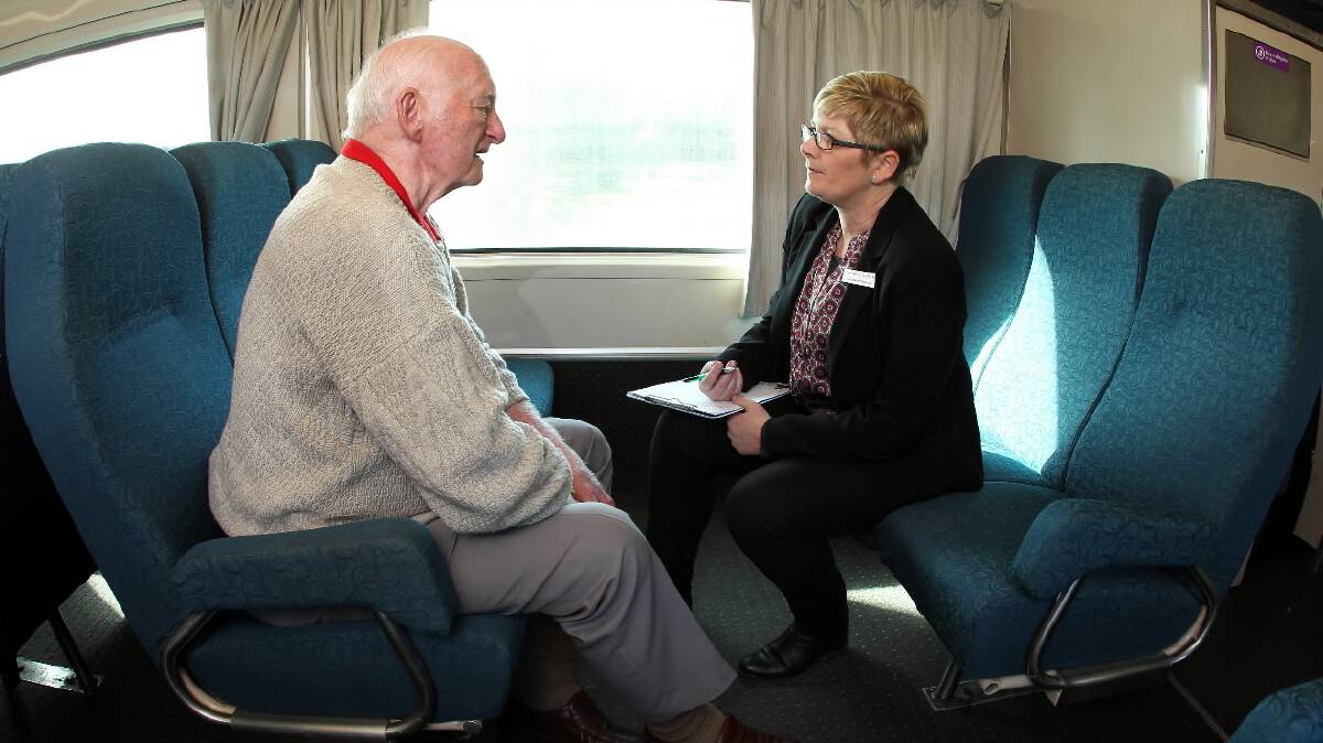 Ms Podesta talks to Leon Dickinson, from Thurgoona, on the train trip yesterday.
