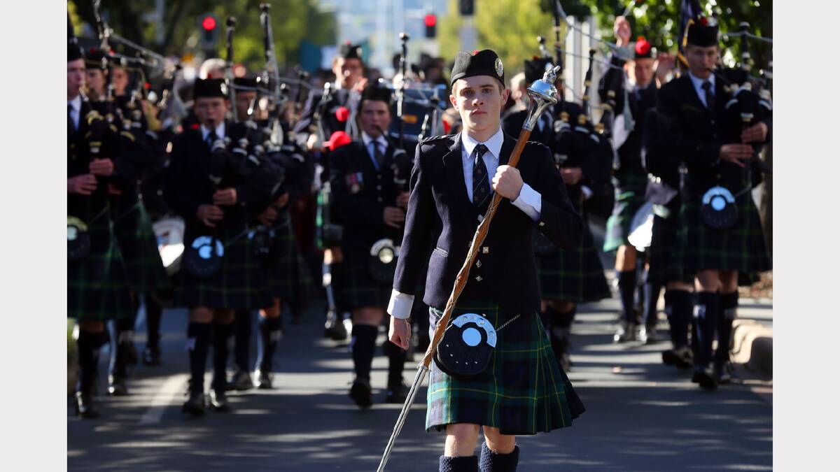 Drum Major Lachie Richardson of The Scots School leads the band.