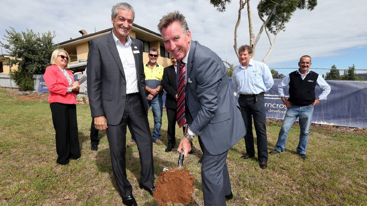 Living Care executive director Graham Reed watches the turning of the first sod on the Borella House redevelopment by Albury Mayor Kevin Mack. Picture: PETER MERKESTEYN 